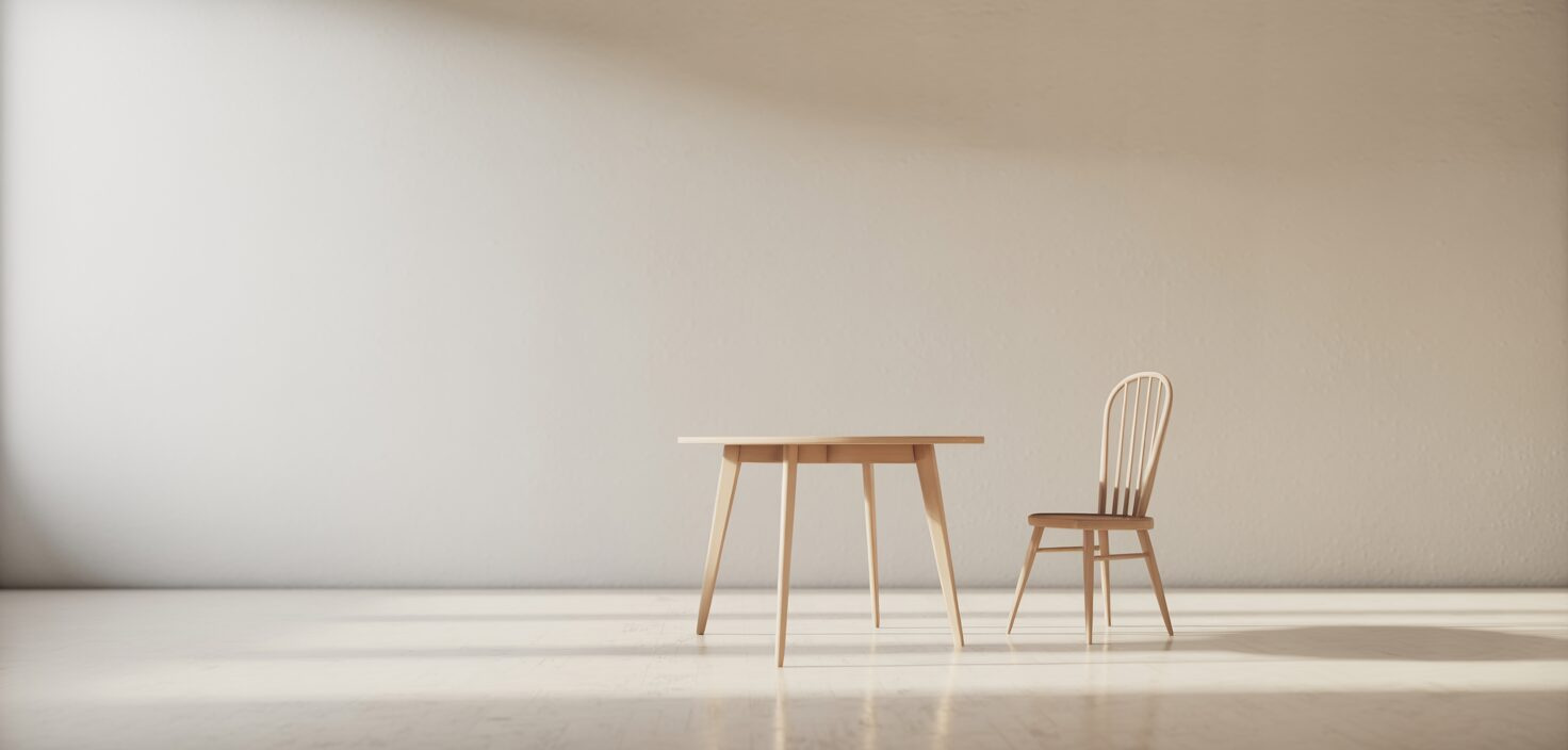Ett fotorealistiskt fotografi av en minimalistisk och modern lägenhet med ljusa väggar, ett enda bord och en tom stol, som representerar tömningen av ett dödsbo.